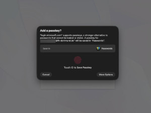 Browser-Dialogfeld „Add a passkey“ für die Website login.microsoft.com. Der Begleittext erklärt, dass Passkeys eine sicherere Alternative zu Passwörtern sind, die nicht geleakt oder gestohlen werden können, und dass der Passkey lokal im Passwort-Manager gespeichert wird.